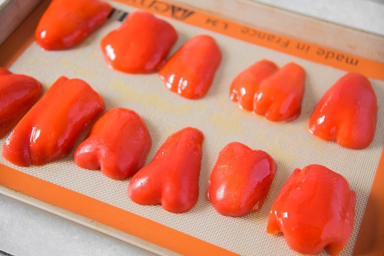 roast red peppers in the oven on a silpat with baking sheet