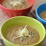 Sauteed Zucchini Puree in bowls topped with seasoning and parmesan cheese