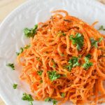 Baked Spiralized Sweet Potato Fries with Garlic and Parsley | oxo hand-held spiralizer
