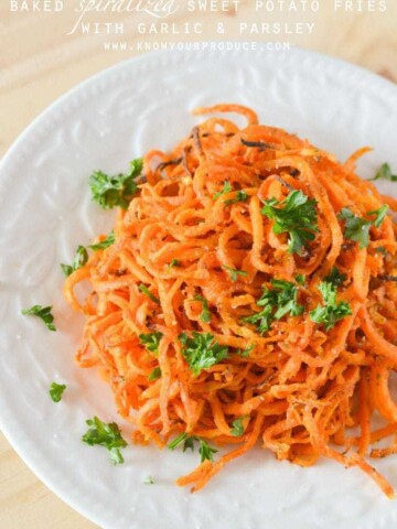 Baked Spiralized Sweet Potato Fries with Garlic and Parsley | oxo hand-held spiralizer