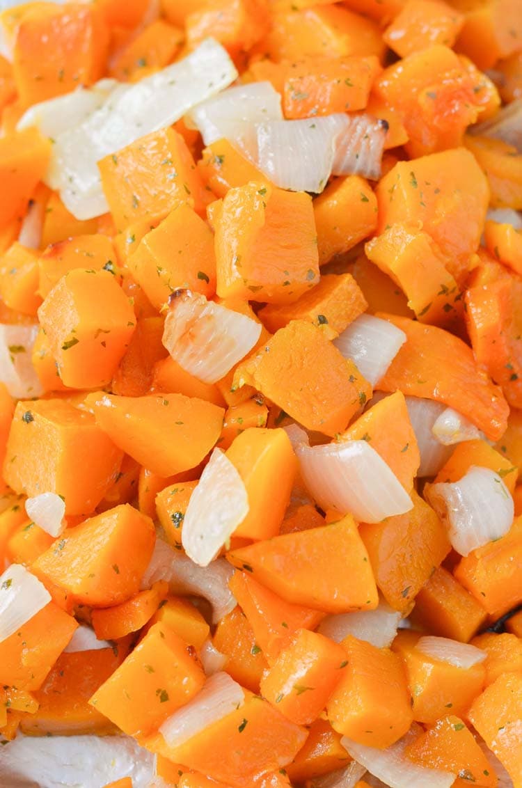 roasted butternut squash with onions on a sheet pan