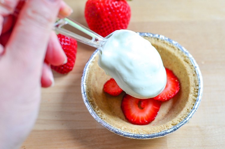 Mini Key Lime Pie with Fresh Strawberries - a quick refreshing and dessert recipe. Have a sweet tooth? Enjoy this as an easy snack! Packed with protein and fruit!