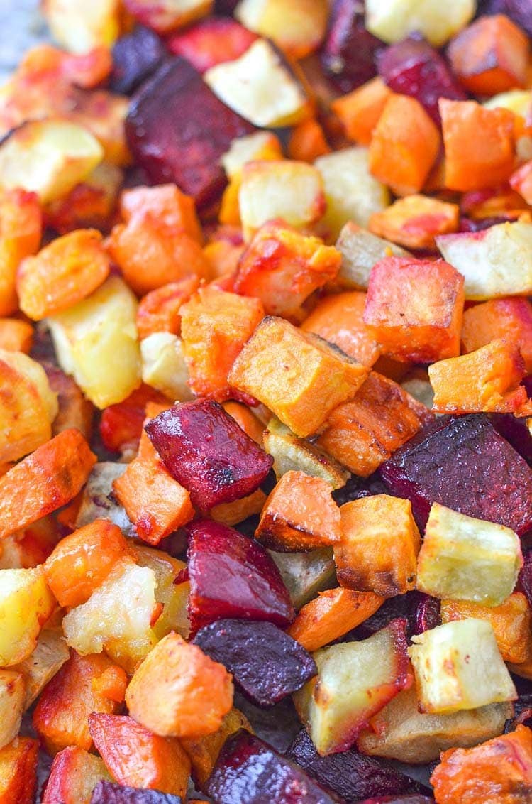 oven roasted beets and sweet potatoes on a sheet pan