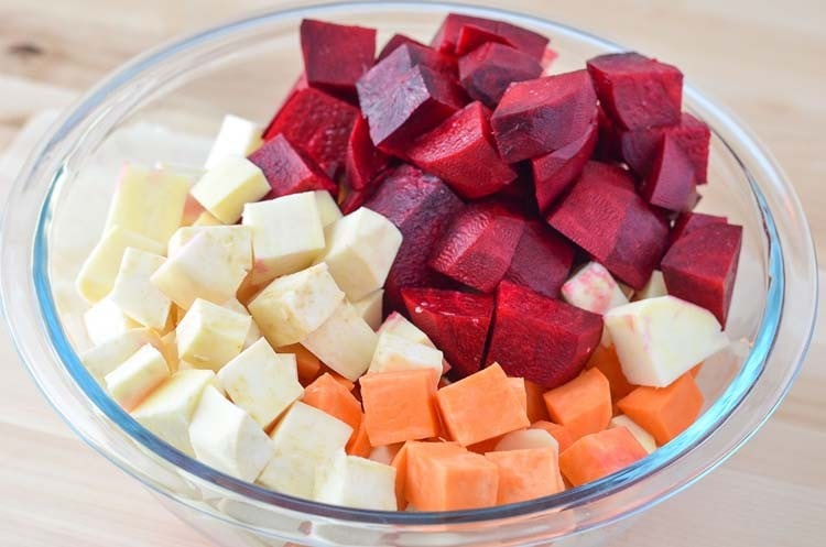 chopped beets and sweet potatoes in a bowl for roasted beets and sweet potatoes