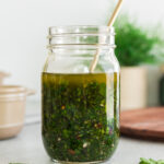 homemade chimichurri sauce in a glass jar.