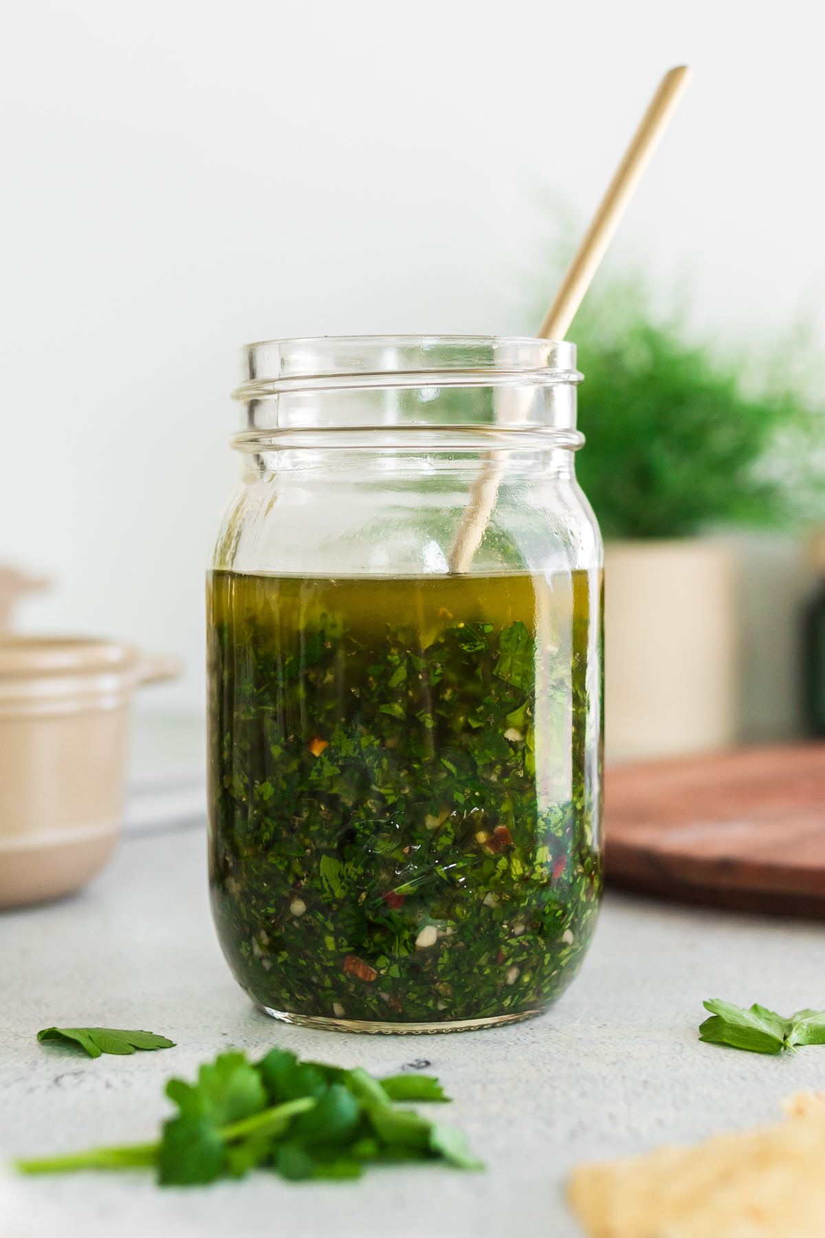 homemade chimichurri sauce in a glass jar.