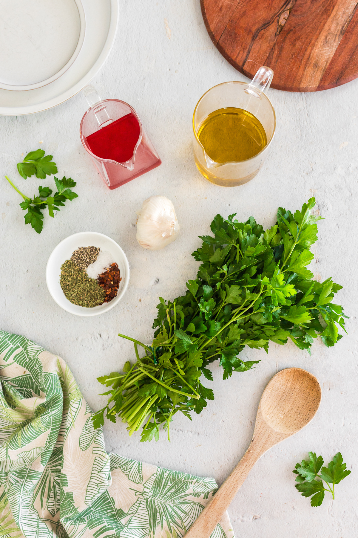 ingredients for chimichurri in a flat lay photo.