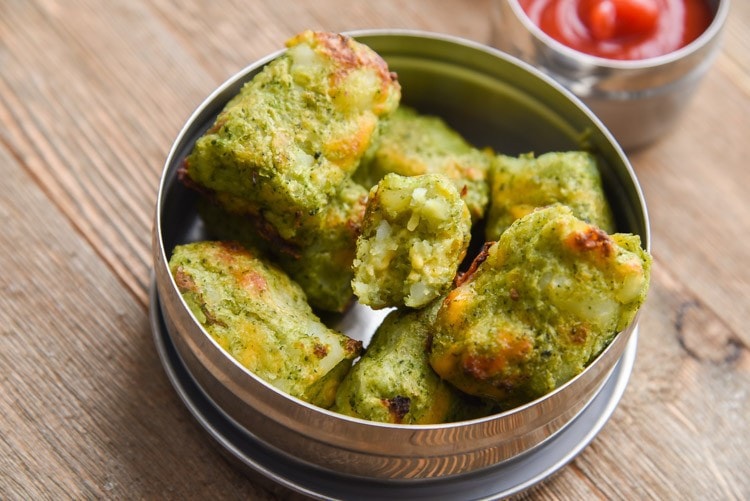 cheddar broccoli tots in a small metal container.