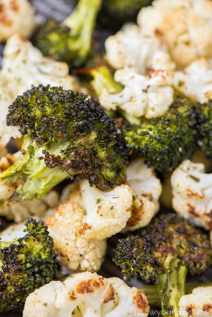 roasted broccoli and cauliflower on a baking sheet