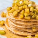 apple cinnamon pancake on a plate with syrup