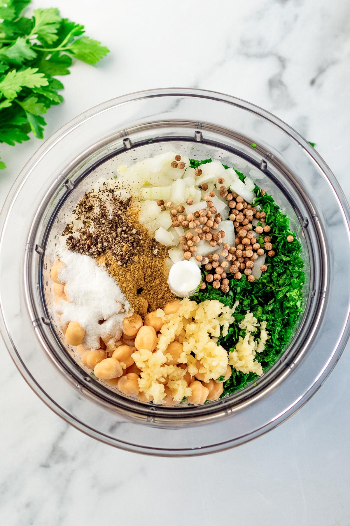 ingredients for falafel in a food processor.