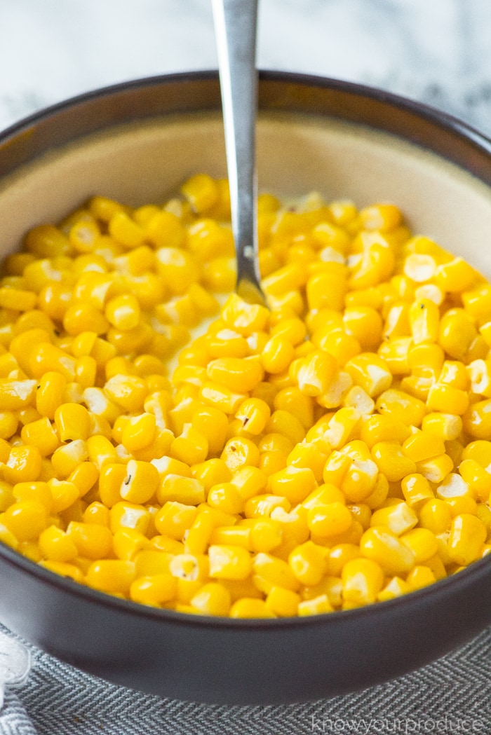 buttered corn in a brown bowl