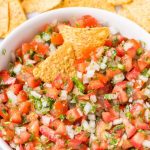pico de gallo in a bowl with tortilla chips