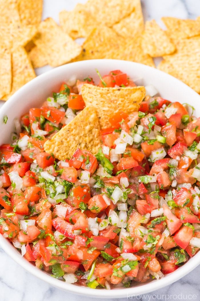 pico de gallo recipe in a bowl with tortilla chips 