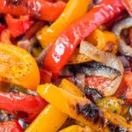 roasted peppers and onions on a baking sheet