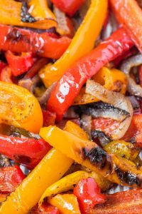 roasted peppers and onions on a baking sheet