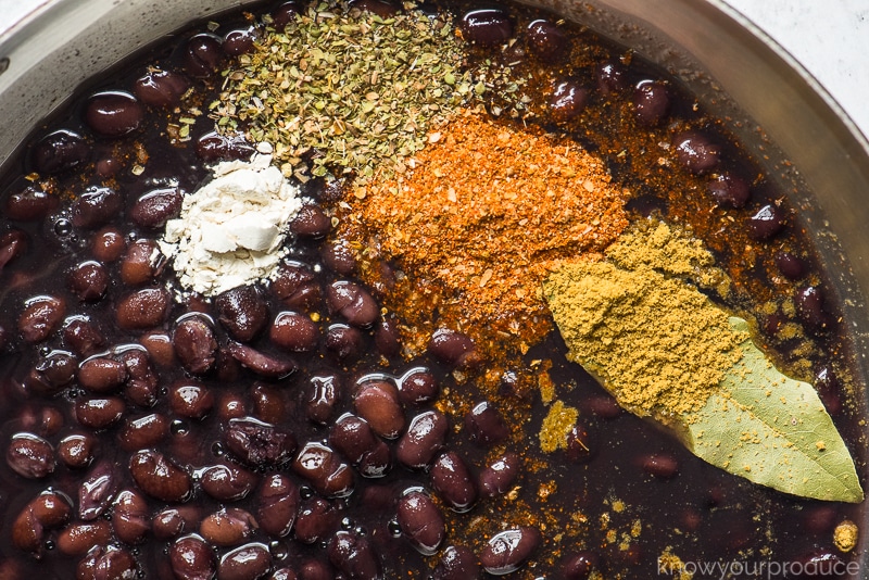 black beans in a skillet with seasonings