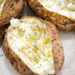 air fryer baked potatoes on a plate