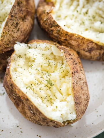 air fryer baked potatoes on a plate