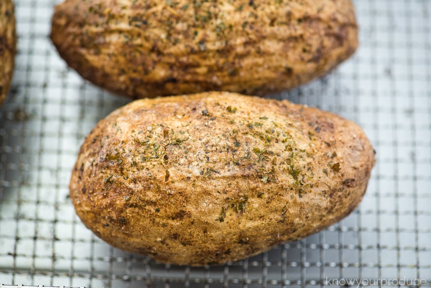 cooked potatoes on an air fryer basket