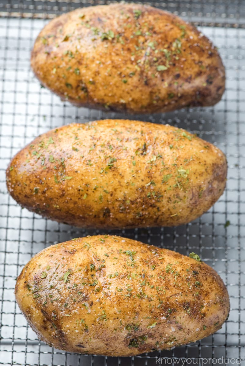 seasoned potatoes on air fryer basket