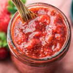 chia seed jam in mason jar with wooden spoon