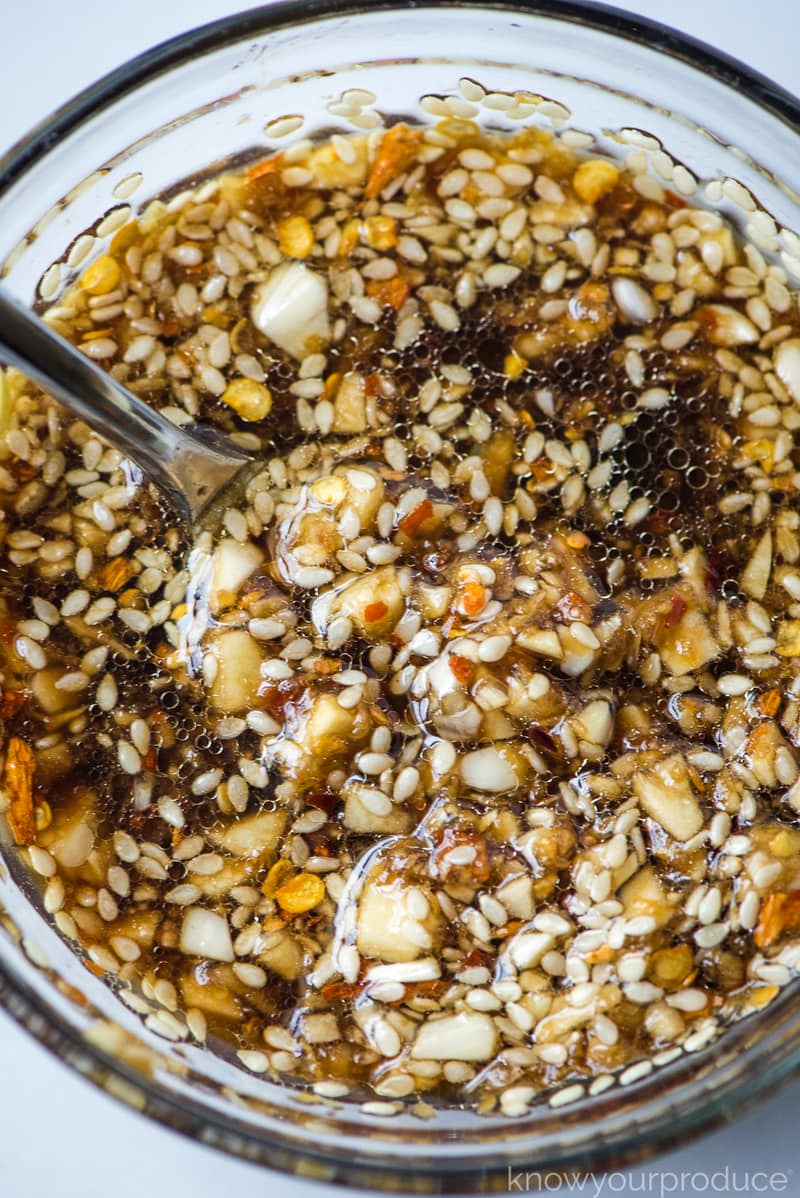 garlic ginger sauce in a glass bowl with a spoon