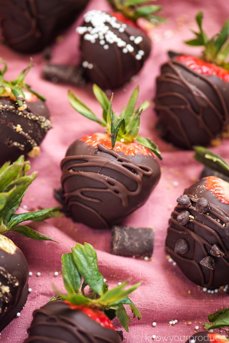 chocolate covered strawberries on a pink napkin