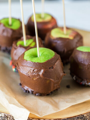 vegan caramel apples on parchment paper