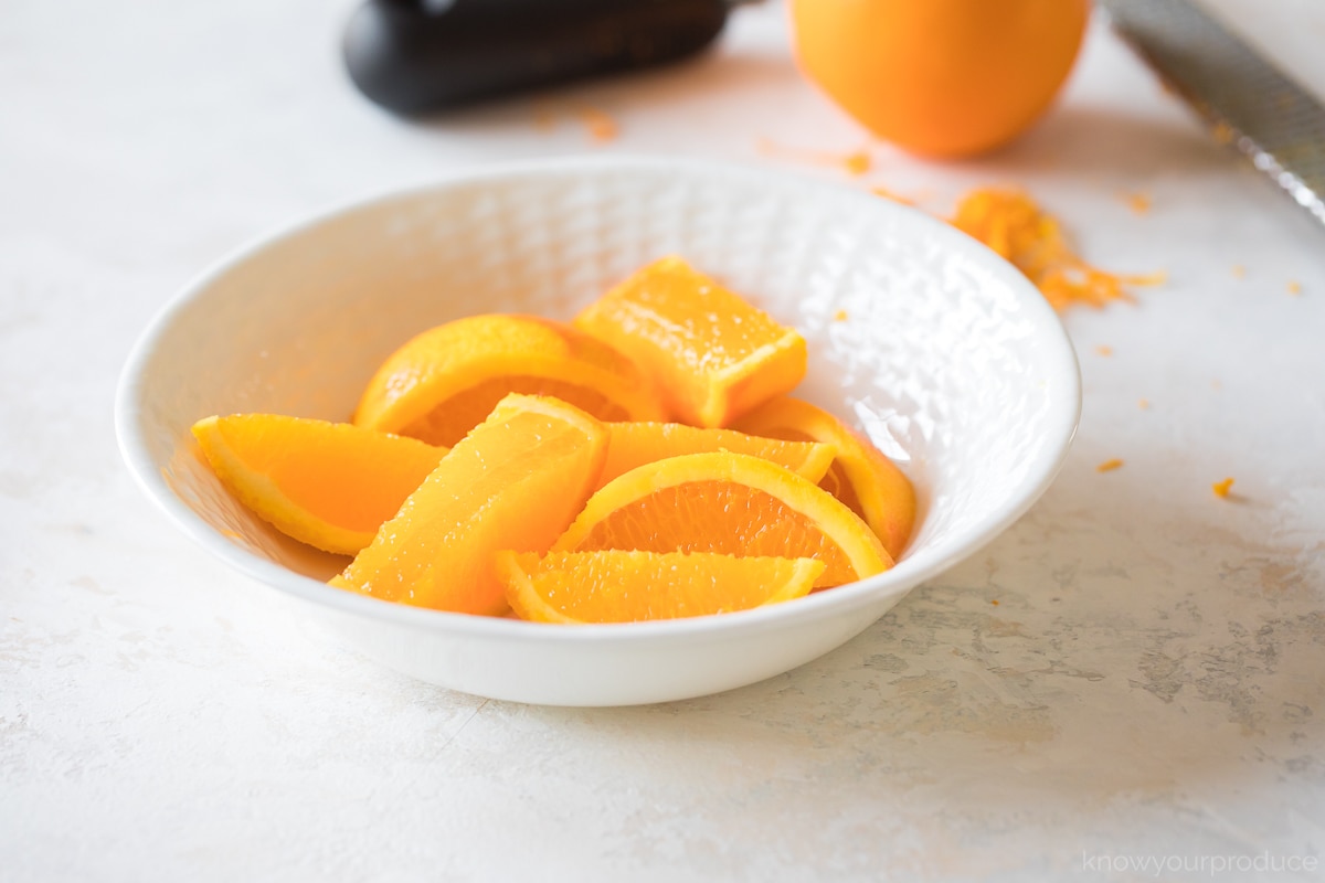 sliced oranges in a bowl