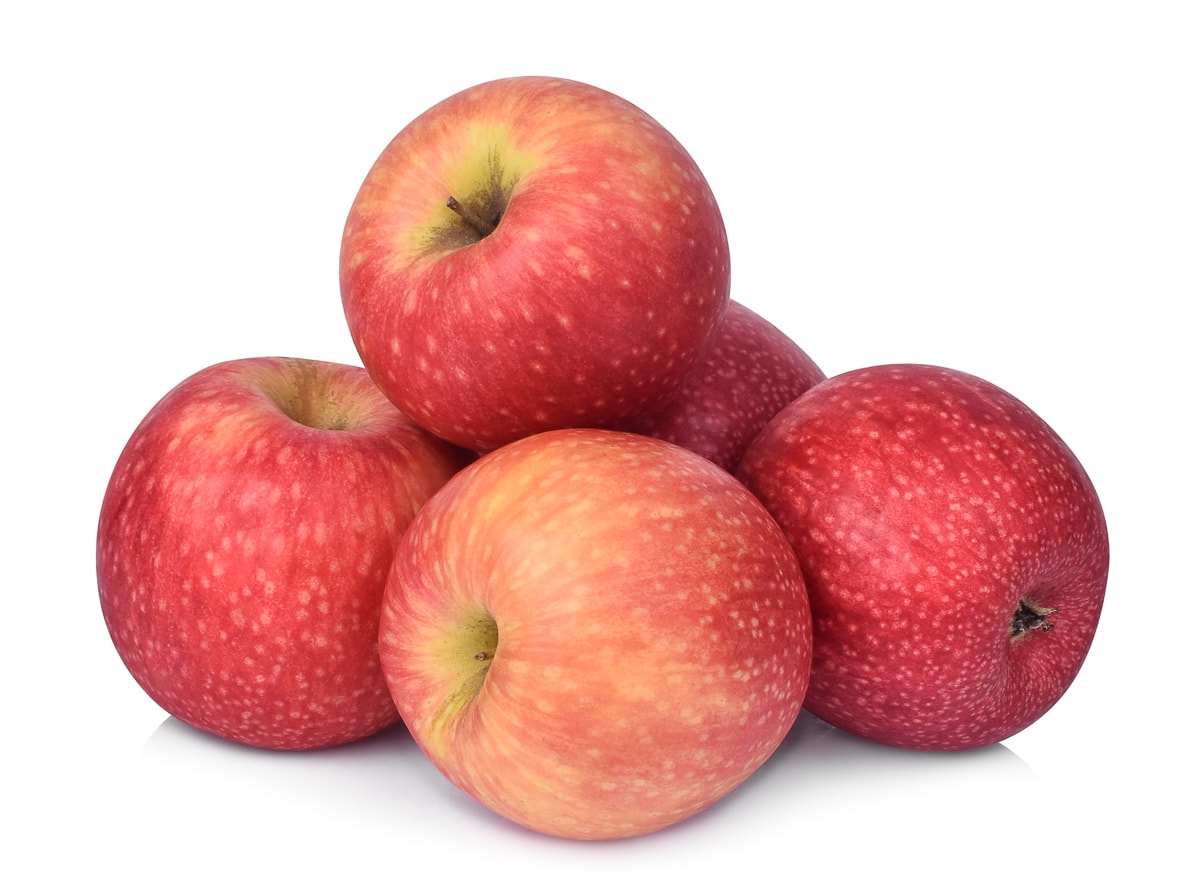 5 pink lady apples isolated on a white background