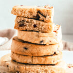 close up of cranberry orange shortbread cookies stacked