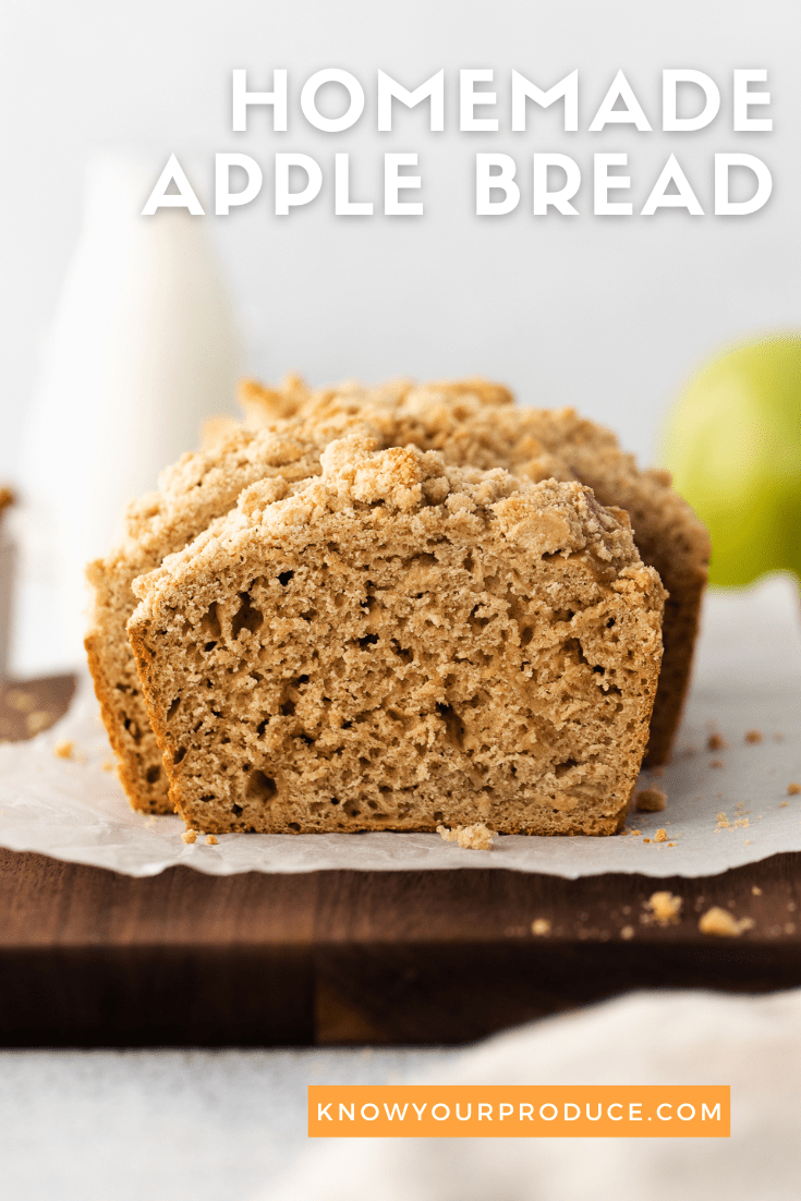 apple bread sliced on a wood cutting board with text on image saying homemade apple bread for pinterest pins.