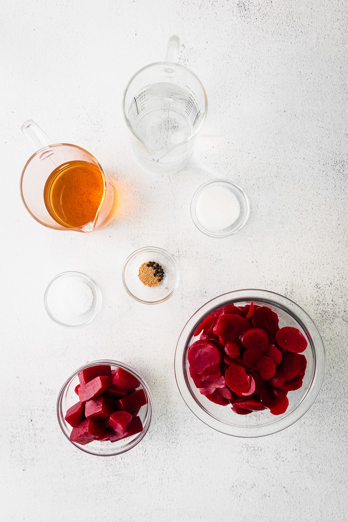 overhead photo of ingredients to make quick pickled beets in bowls.