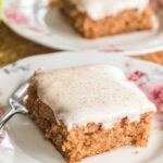 applesauce cake with cream cheese frosting slice plated.
