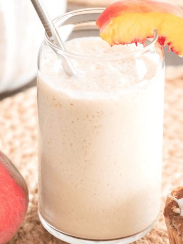 peach milk in a glass.