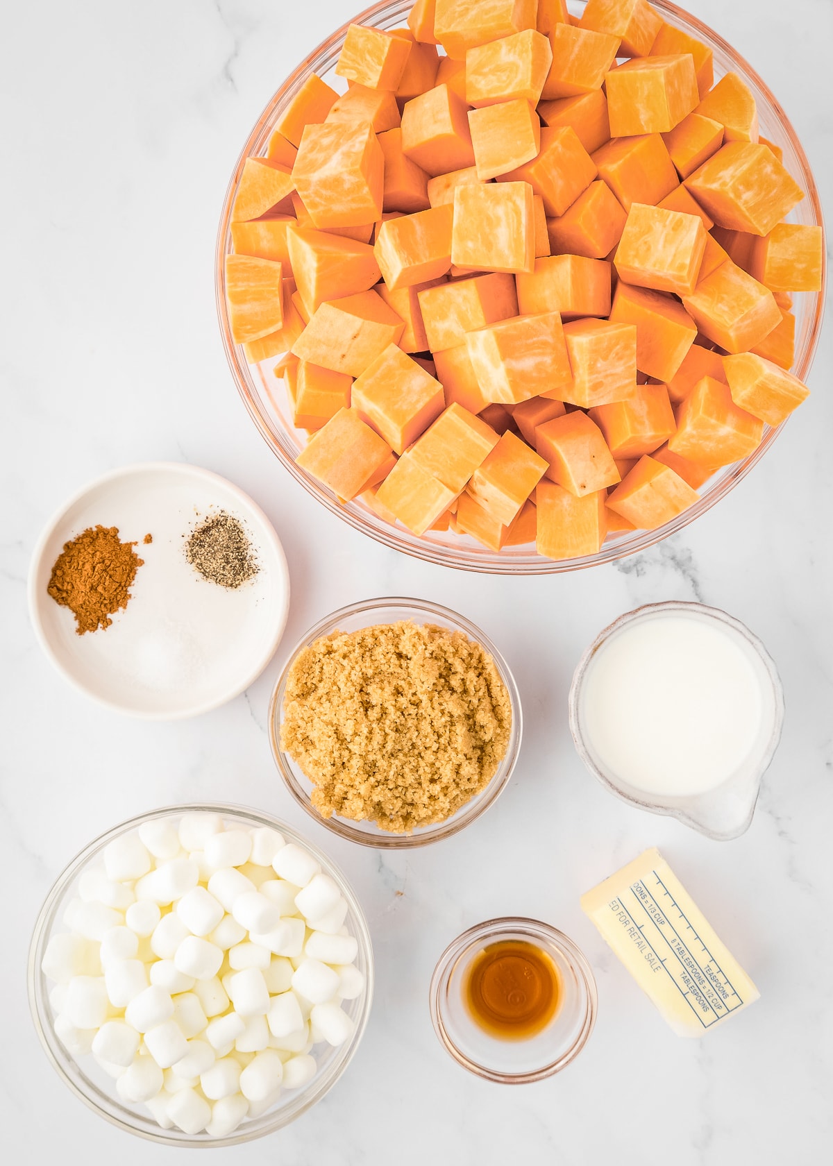 ingredients in bowls overhead photo for sweet potato casserole.