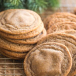 soft gingerbread cookies piled on a cooling rack.