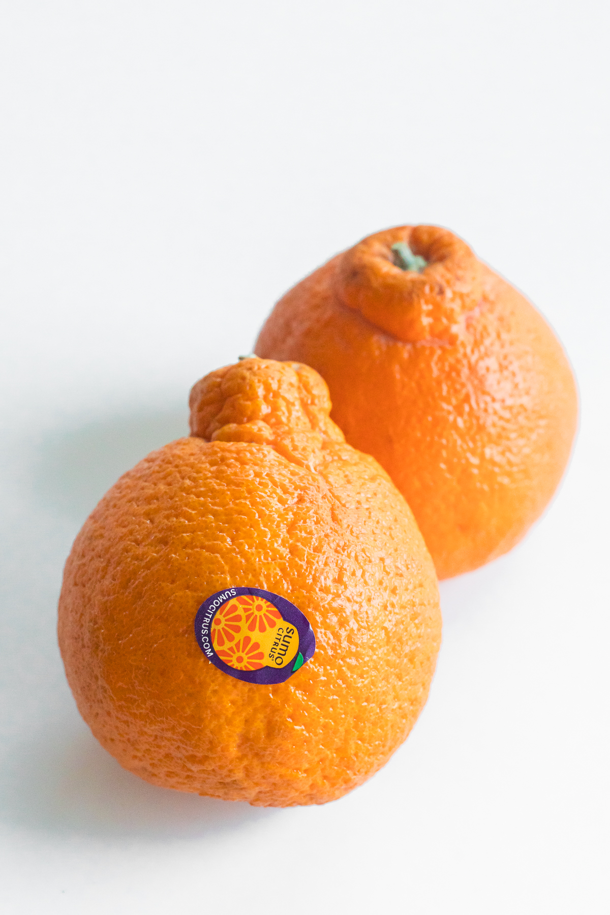 two sumo citrus mandarin oranges.