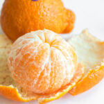 sumo citrus mandarin peeled open.
