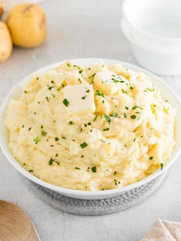 mashed potatoes in a white bowl.