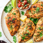 plate of pan seared cilantro lime chicken breasts.