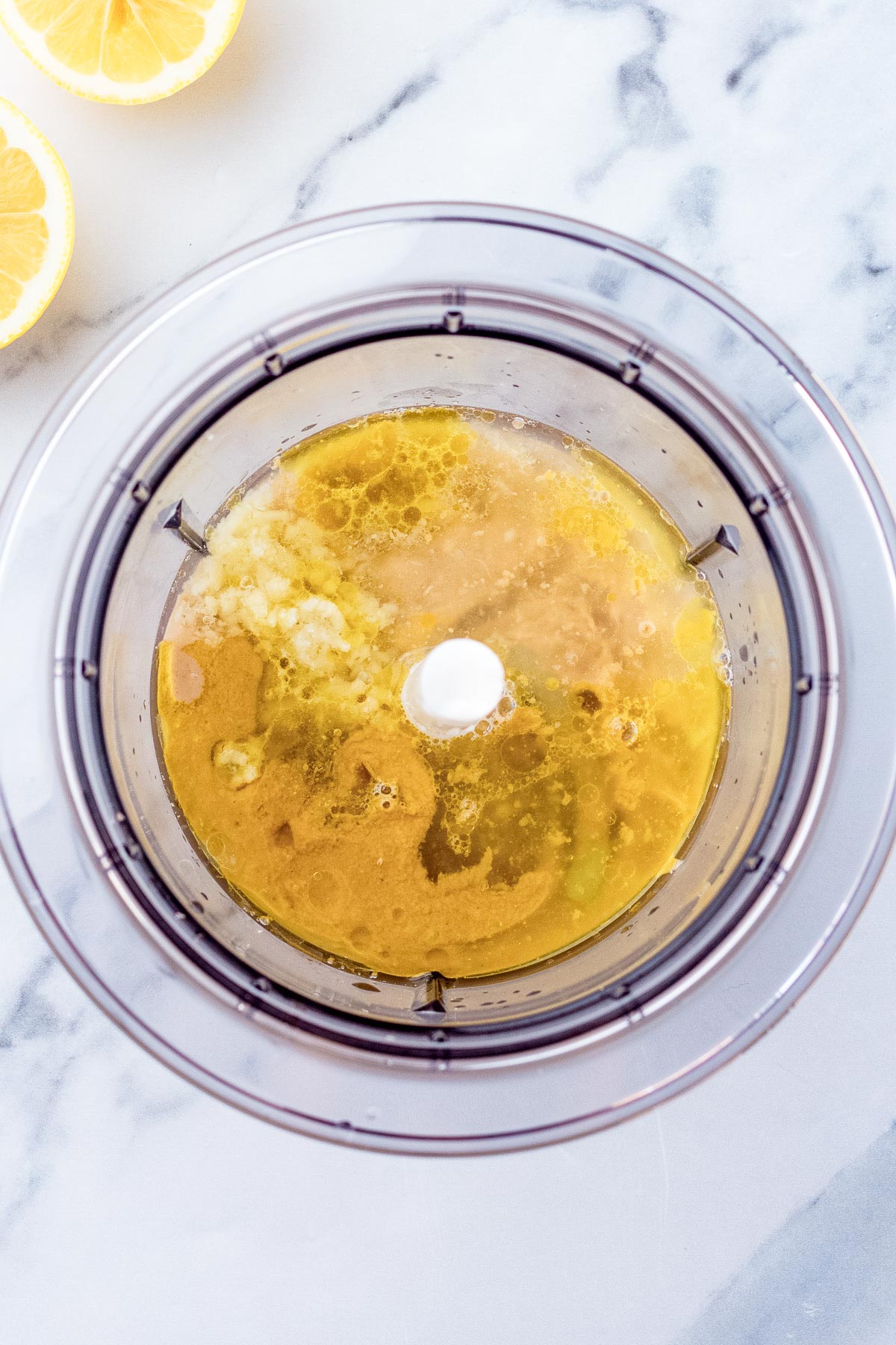 liquid ingredients in a food processor.