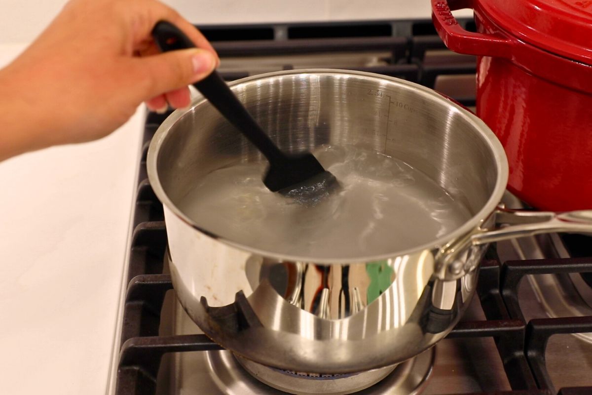 mixing pickling brine in saucepan.