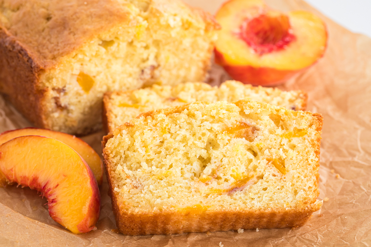 close up of peach bread showing peaches inside.