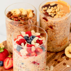 overnight oats in glass containers with toppings.