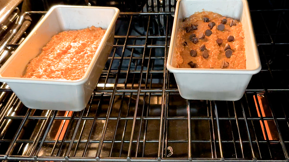 apple carrot bread loaves in oven baking.