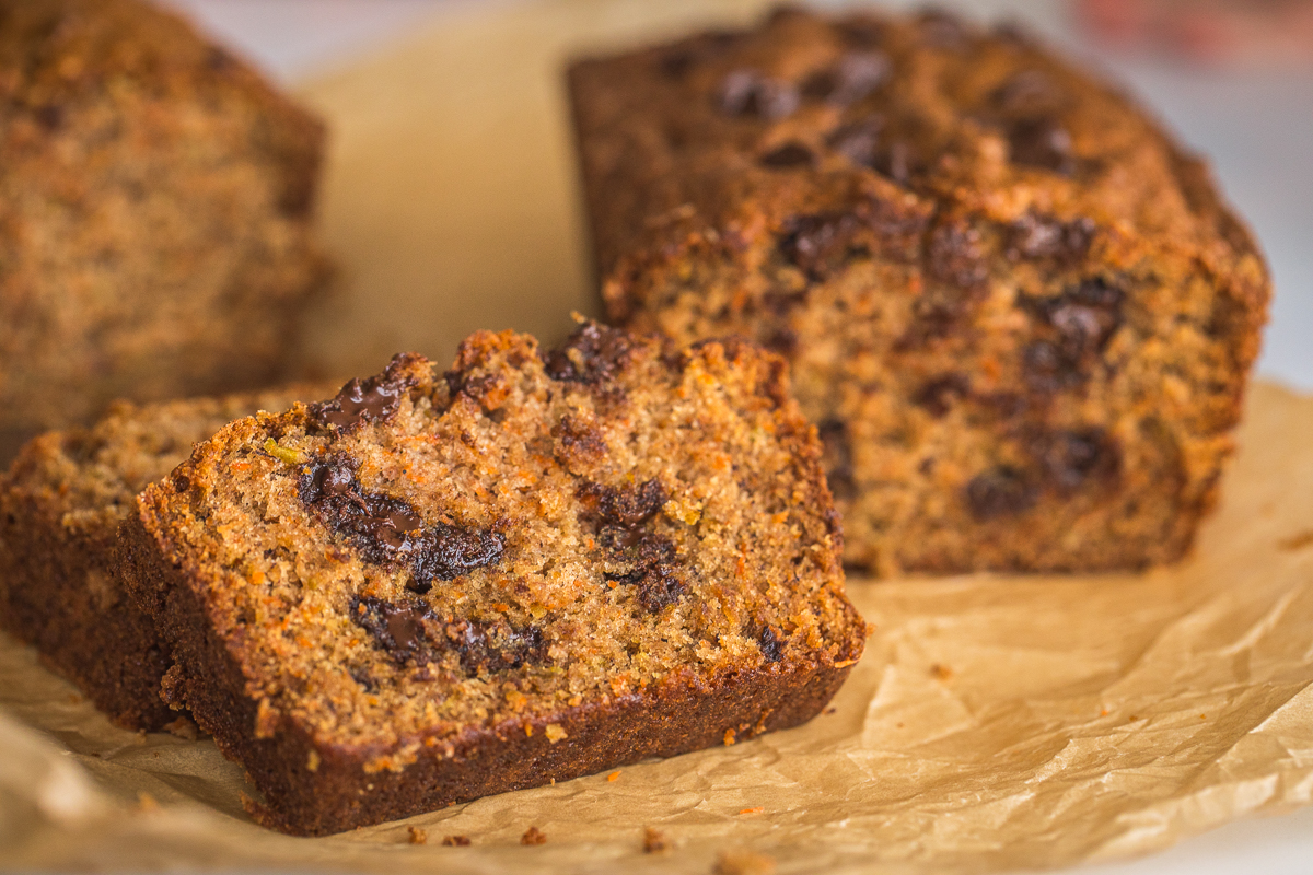 apple carrot bread with chocolate chips in it cut open to see.