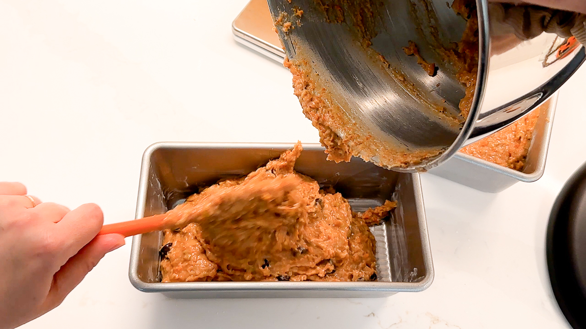 dividing batter in between pans.