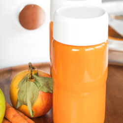 apple carrot juice in nama bottles.